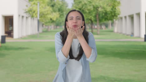 happy indian girl giving flying kisses