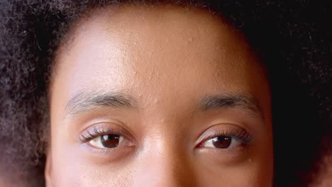 Portrait-of-happy-eyes-of-african-american-woman-at-home,-in-slow-motion