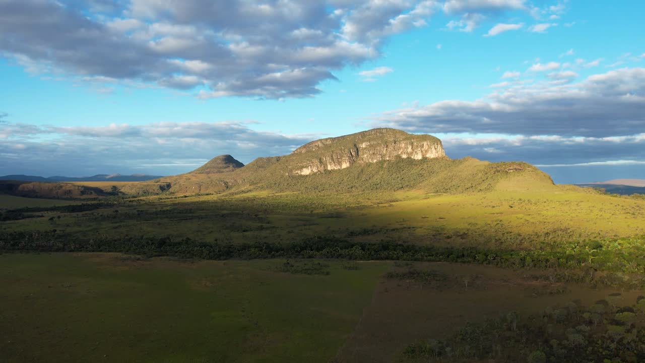panoramic aerial Maytrea Garden and Morro da Baleia, Jardim de Maytrea, green fields, mountains, sunset, Chapada dos Veadeiros, Goiás, Alto Paraíso