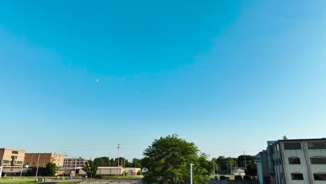 aerial tracking of distant helicopter on a summer day