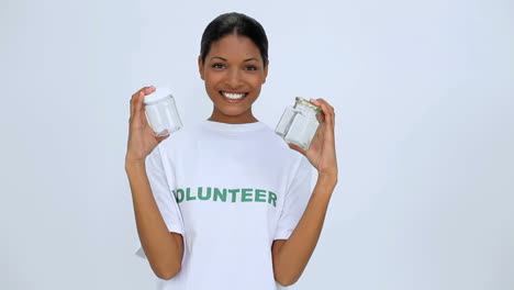 Volunteer-woman-showing-two-jar-