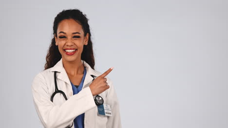 Medical-doctor,-pointing-and-woman-in-studio