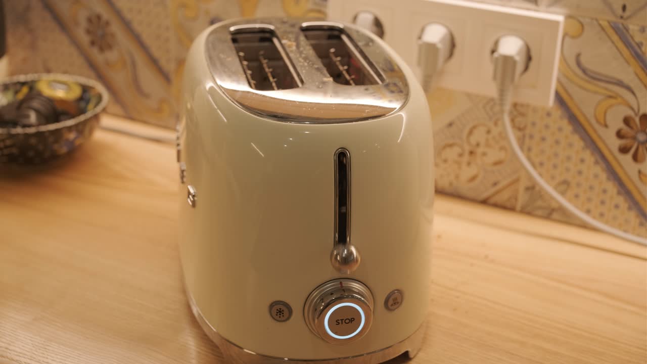 Bread Slices Being Toasted in a Modern Kitchen Toaster