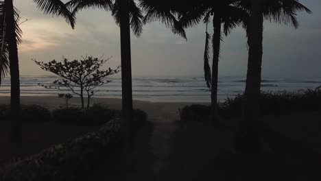 establishing aerial shot of dramatic sunrise over beautiful beach in brazil