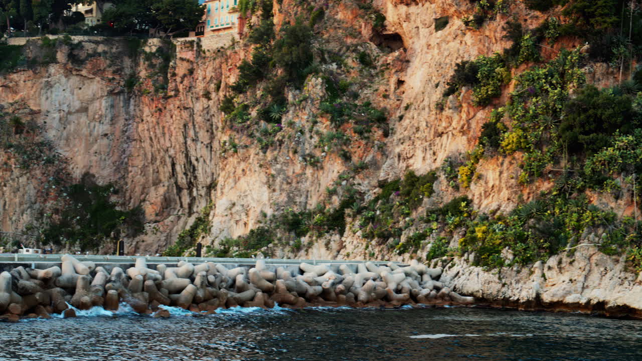 Distant view of the The Cathedral of Our Immaculate Lady and the buildings on the shore in Monaco