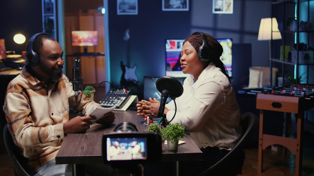 Cohosts streaming podcast using professional vlogging camera