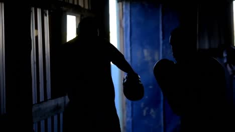 trainer assisting boxer in fitness studio 4k