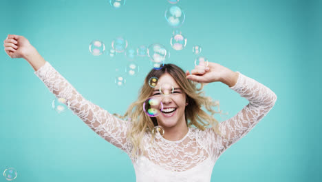 Crazy-face-woman-dancing-in-bubble-shower-slow-motion-photo-booth-blue-background