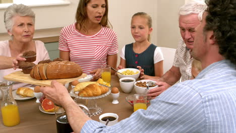 multi generation family having breakfast