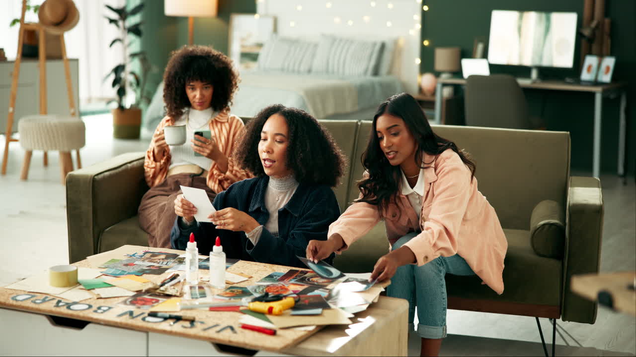 Women creating a vision board together in a living room