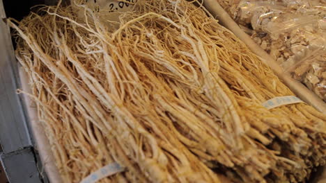 dried ginseng roots for sale at a market