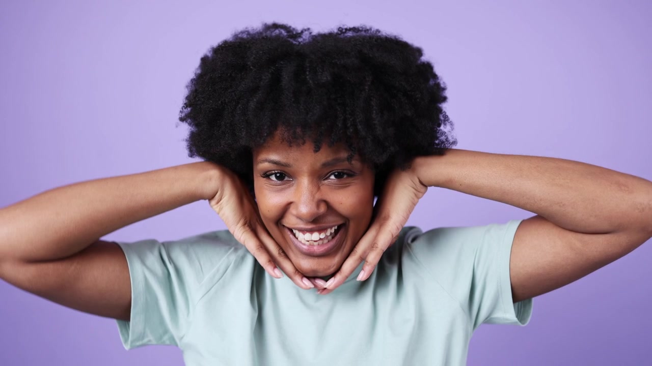Joyful African American Woman Smiling and Making Playful Gestures