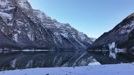 beautiful klöntalersee lake in klöntal, glarus, switzerland, snowy mountains and serene winter reflections, scenic landscapes.