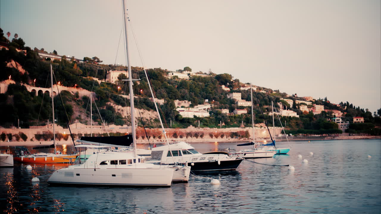 Villefranche Sur Mer, France - December 8, 2024: Boats docked in the Port de Villefranche-sur-Mer in the evening