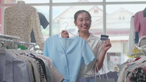 woman shopping for clothes in a clothing store