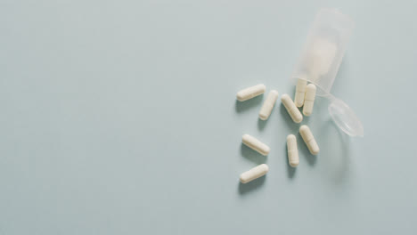 video of close up of box of white pills on white background