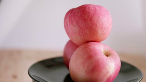 A-showcase-of-colorful-tasty-apple-on-a-rotating-surface-it-has-bright-red-color-and-looks-very-appetizing