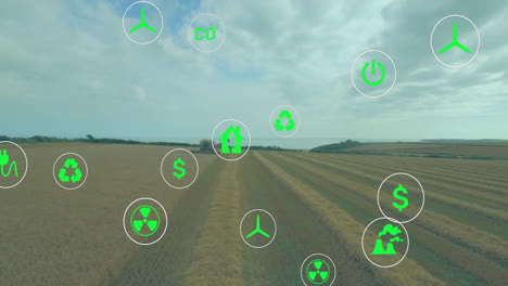 green energy and sustainability icons animation over agricultural field