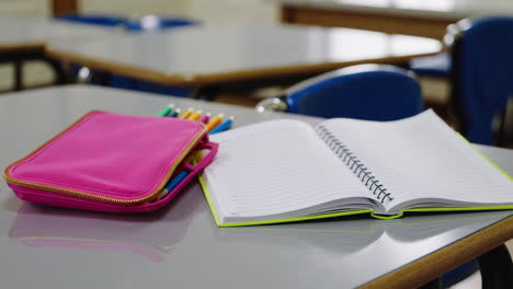 classroom desk with supplies