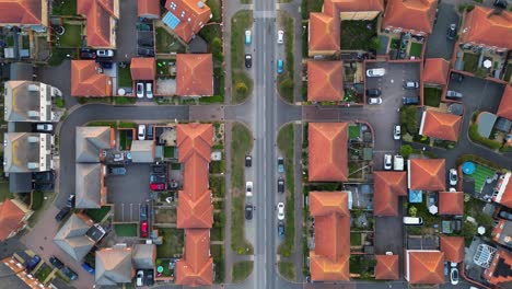 smooth towards aerial movement above the aylesham's main road with homes, united kingdom