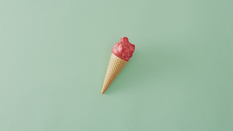 Video-of-cone-with-ice-creams-lying-on-green-surface