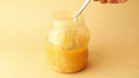 Homemade-ghee-in-container-on-a-table