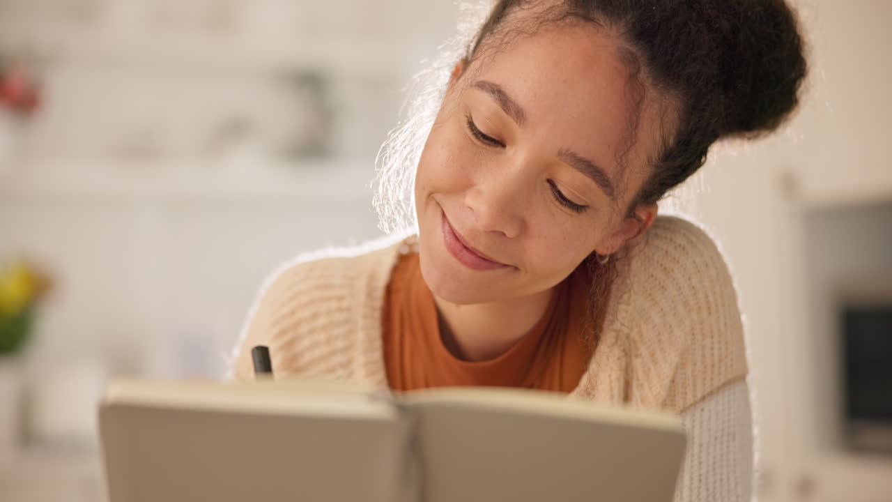 Thinking, writing in book and woman in home
