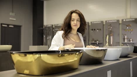 woman shopping for bathroom sinks
