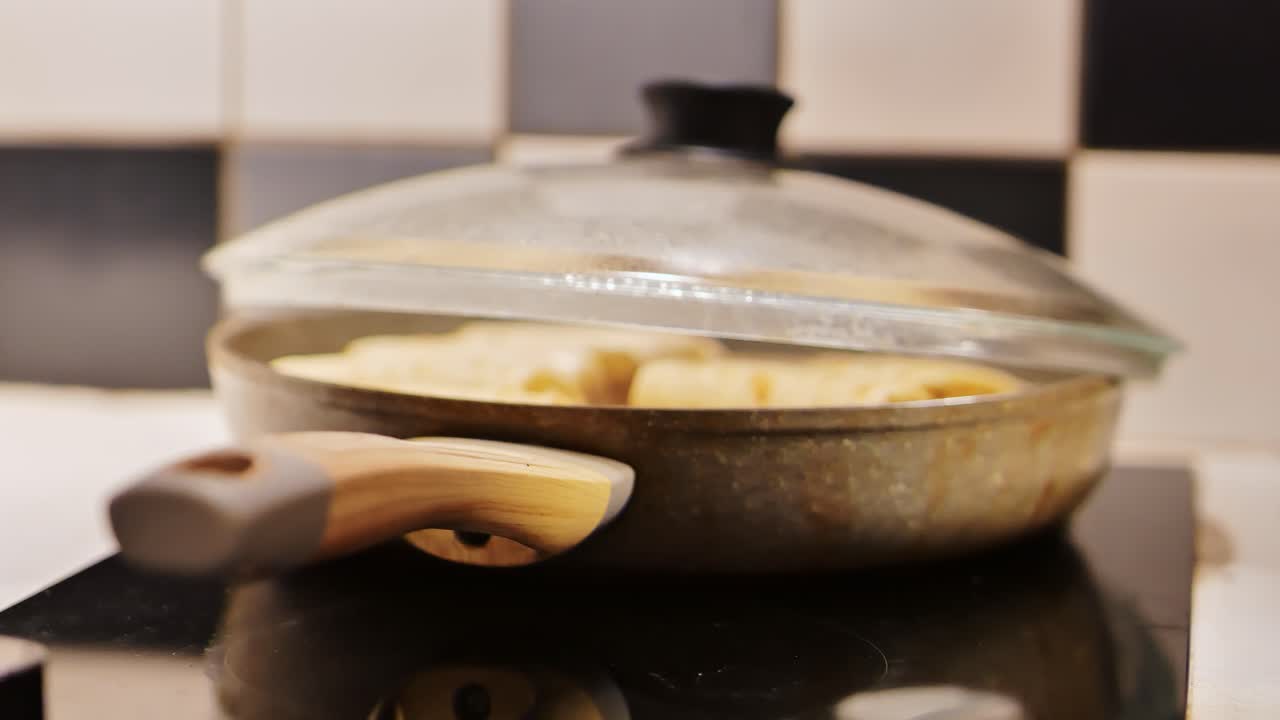 Covered pan traps flavor as fillets cook slowly in homely stovetop setting