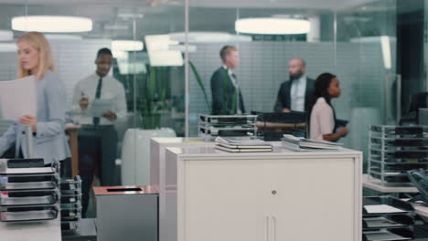 confident-saleswoman-using-telephone-having-phone-call-chatting-to-client-insurance-broker-sitting-at-desk-discussing-sales-in-busy-office