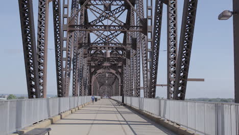 first person view of pedestrian bridge in louisville over the ohio river