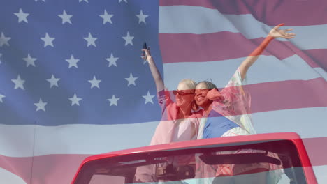 Animation-of-flag-of-usa-over-happy-diverse-women-in-car-by-beach-in-summer