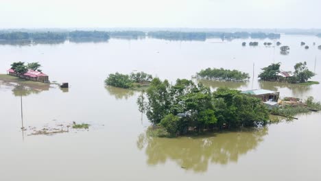 flooded village. houses and school submerged by flood water in bangladesh. aerial view