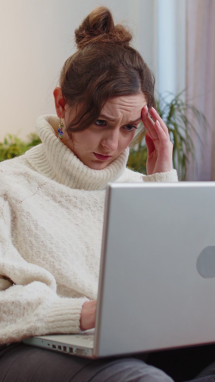 Tired young woman freelancer use laptop suffering from headache problem tension and migraine stress