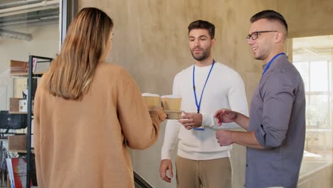 business people drinking takeaway coffee at office