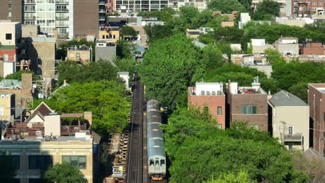 l train in downtown chicago during summer