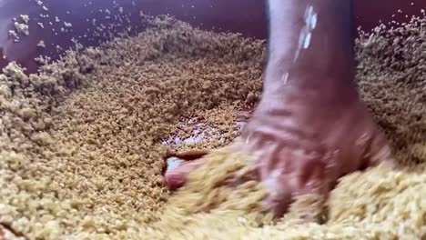 hands close up chef making cous cous traditional north african dish from semolina durum wheat slow motion