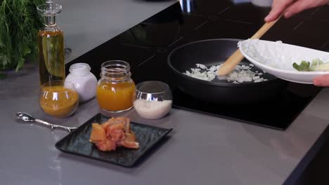 friyng onion before meat cooking in a pan