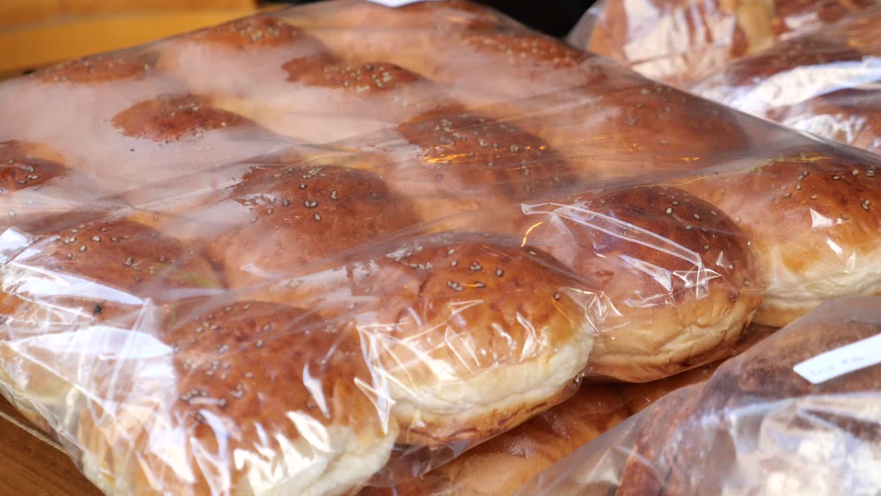 Freshly Baked Buns in Plastic Wrap