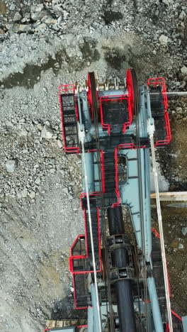 aerial view of a rocky construction site with heavy machinery