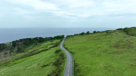 majestic road leading to spanish coast, aerial drone view