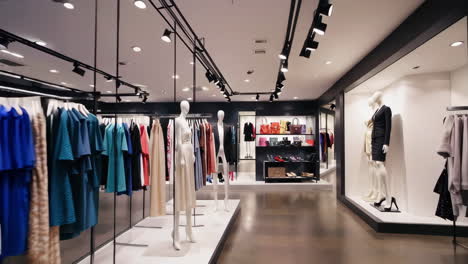 interior view of a modern fashion boutique with clothing, handbags, and shoes on display