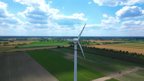 aerial drone view of wind power turbines, part of a wind farm