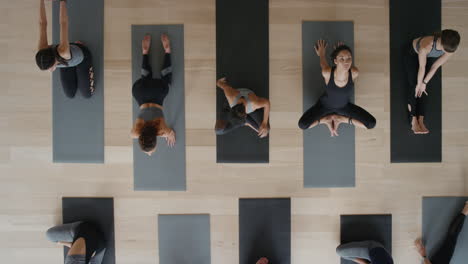 top view yoga class healthy women stretching preparing for workout exercising in studio enjoying fitness lifestyle