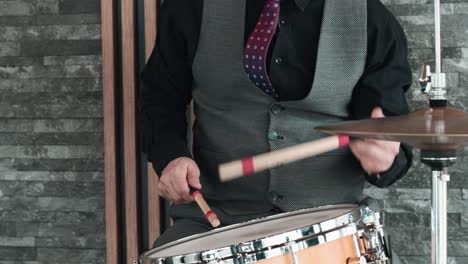 Drummer-calmly-playing-drums-at-a-party