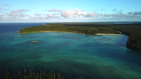 oro's bay in the isle of pines in new caledonia - pull back aerial view of a tropical paradise