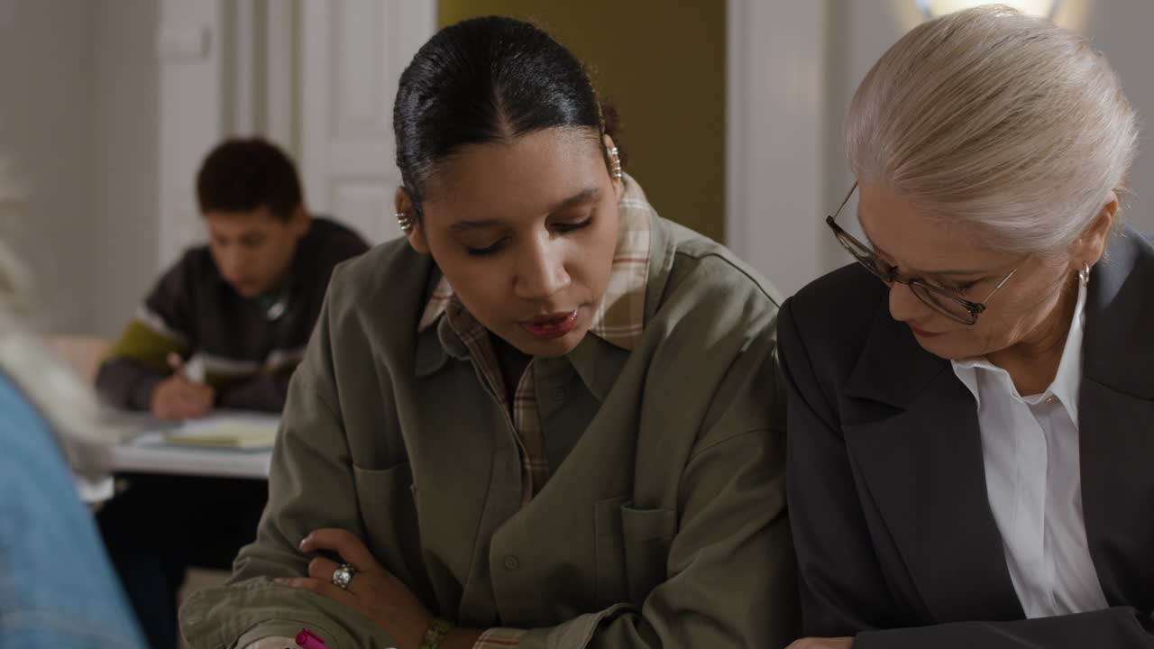 People at a meeting or in a classroom