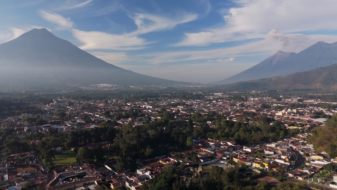 Aerials of the cityscapes of Antigua Fuego volcano on the background, Guatemala