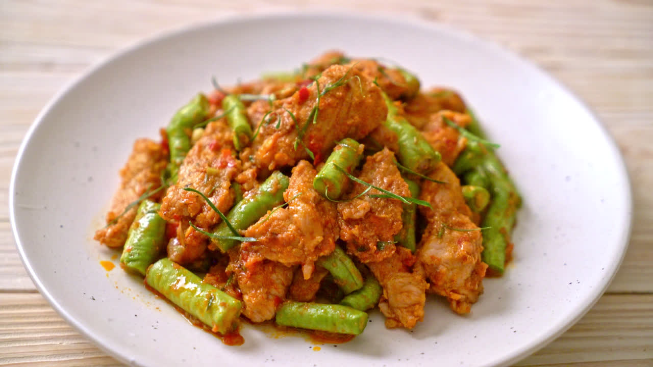 Stir fried pork and red curry paste with sting bean - Asian food style