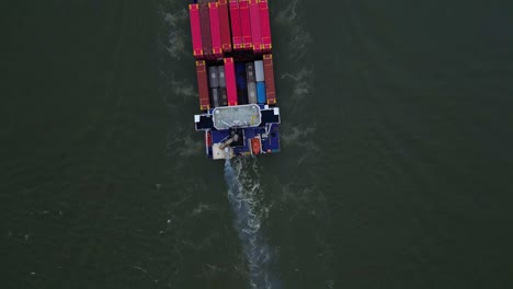 topdown view of energy cargo ship carrying viasea intermodal containers near dordrecht, netherlands